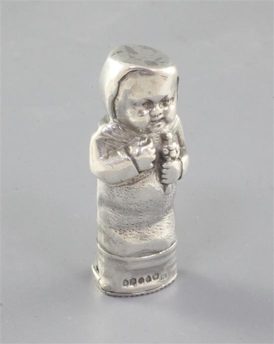 A late 19th century continental silver novelty vesta case modelled as a clothed baby, import marks for Sampson Mordan & Co, 69mm.